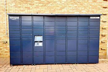 a blue garage door in front of a brick wall